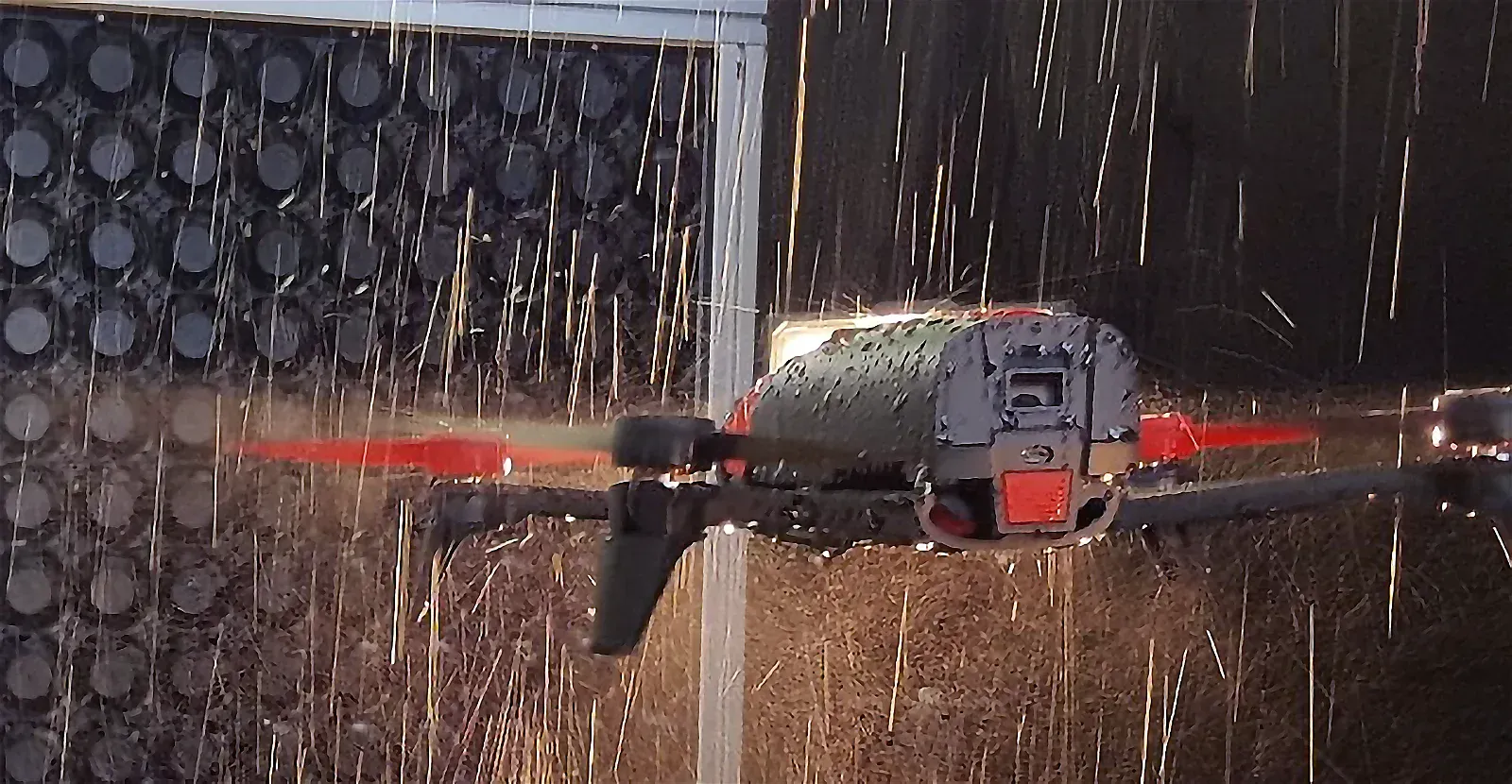 Drone flying in rain conditions in a laboratory environment.